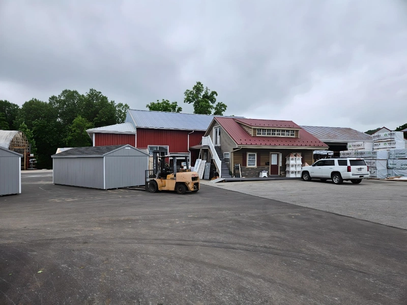 White Pine Structures facility with office building, forklift, and finished sheds in Parkesburg, PA