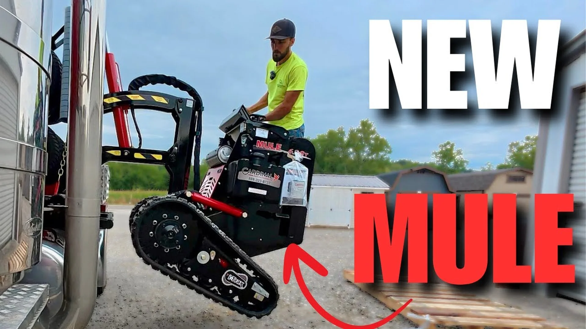 Shed Mule track-driven placement machine by Cardinal Manufacturing positioning a shed in a residential backyard